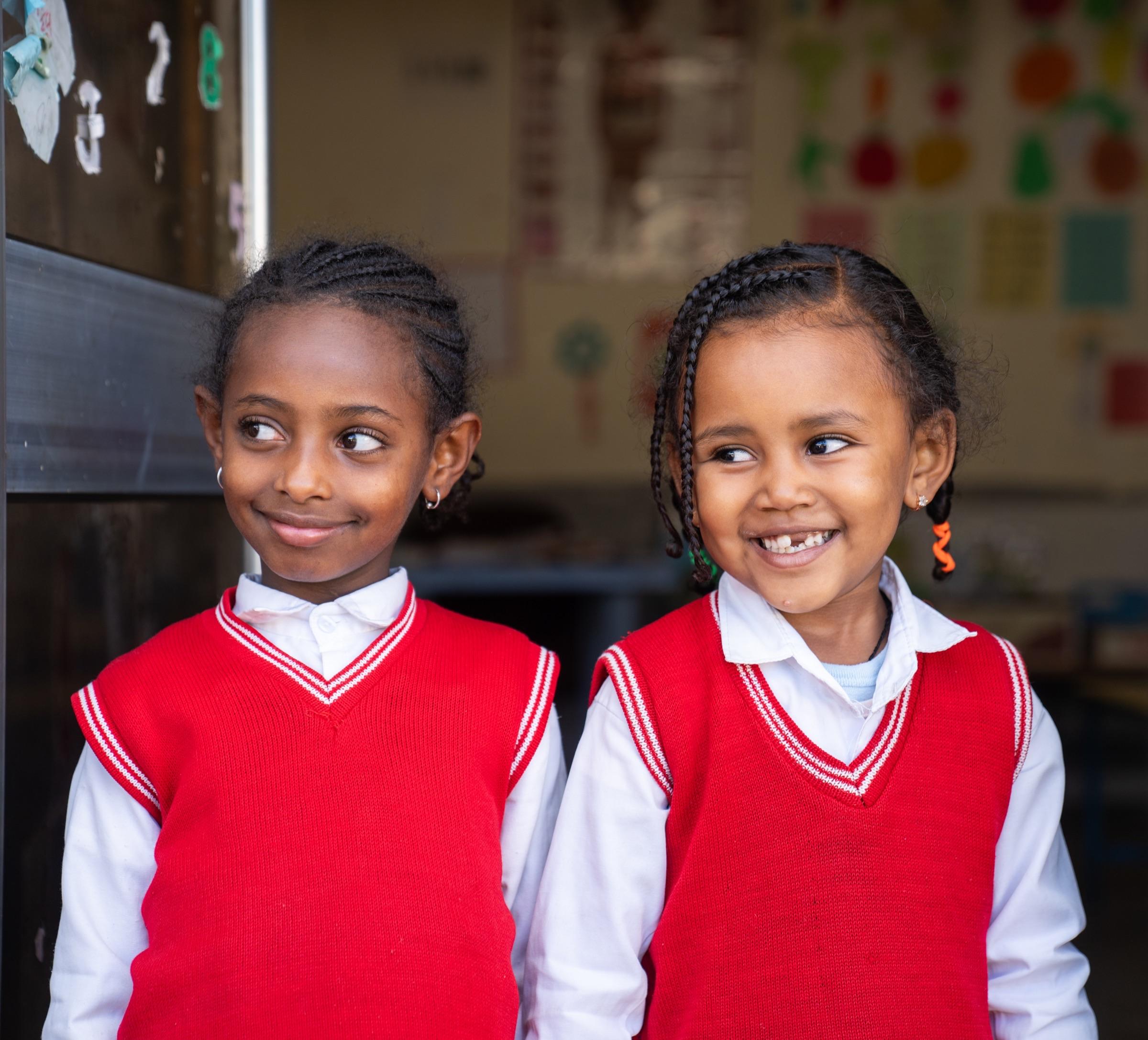 Students in school uniforms at an EDTF-supported classroom